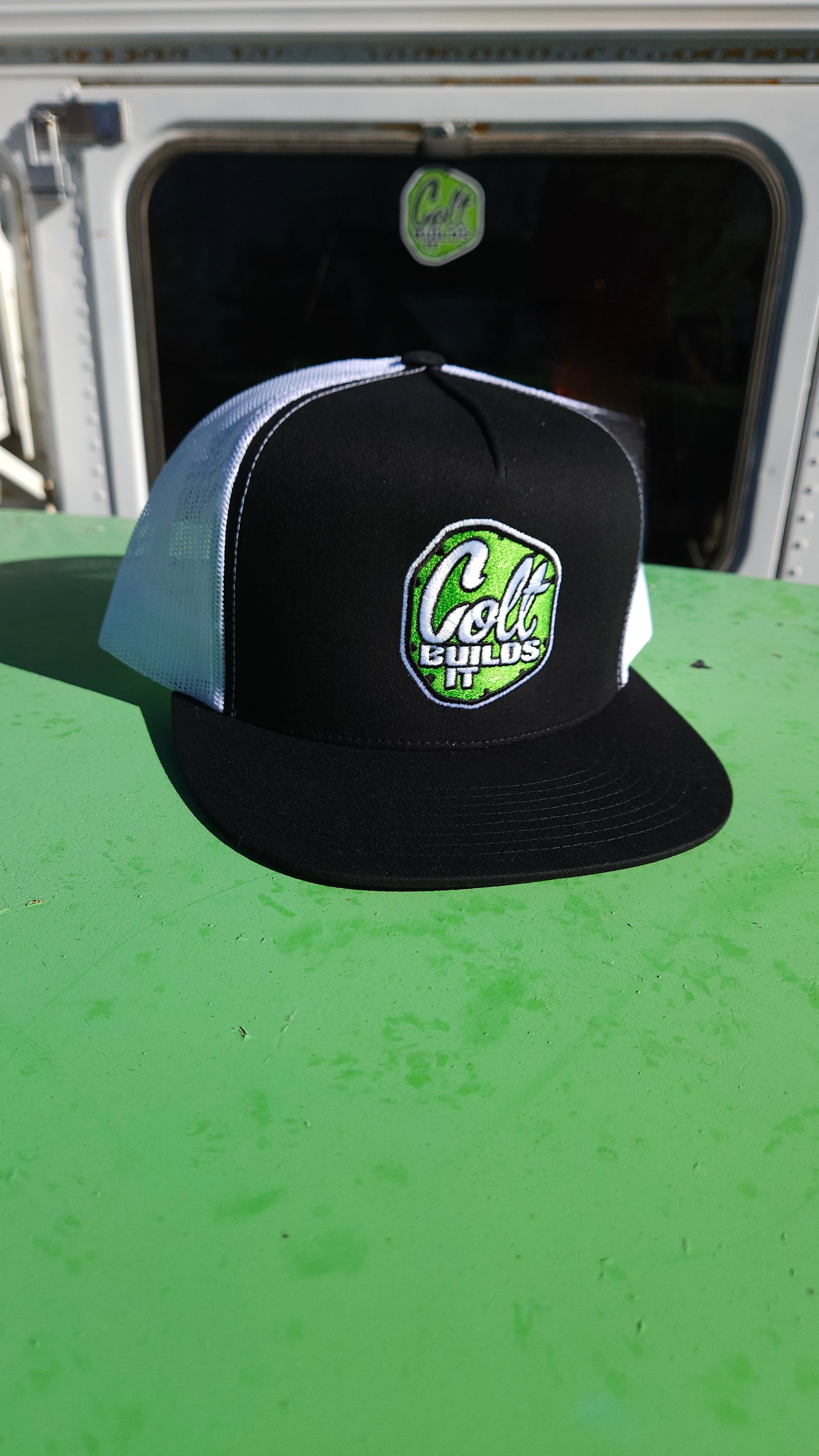 Colt Builds It black and white two-tone trucker snapback hat with embroidered logo